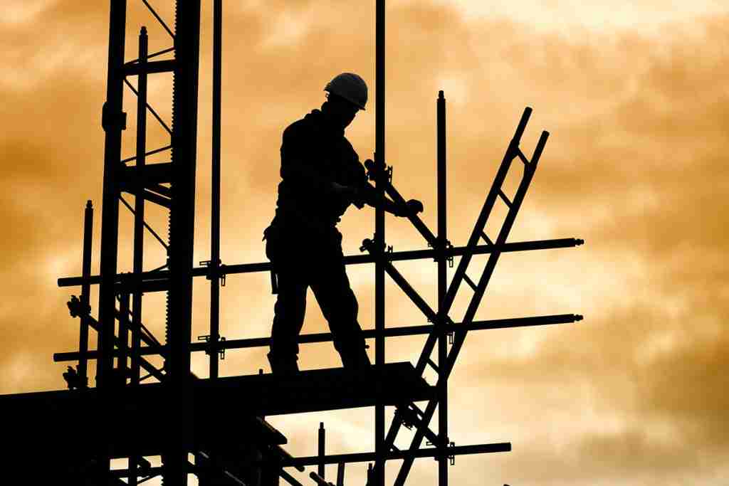 silhouette-of-construction-worker-on-scaffold