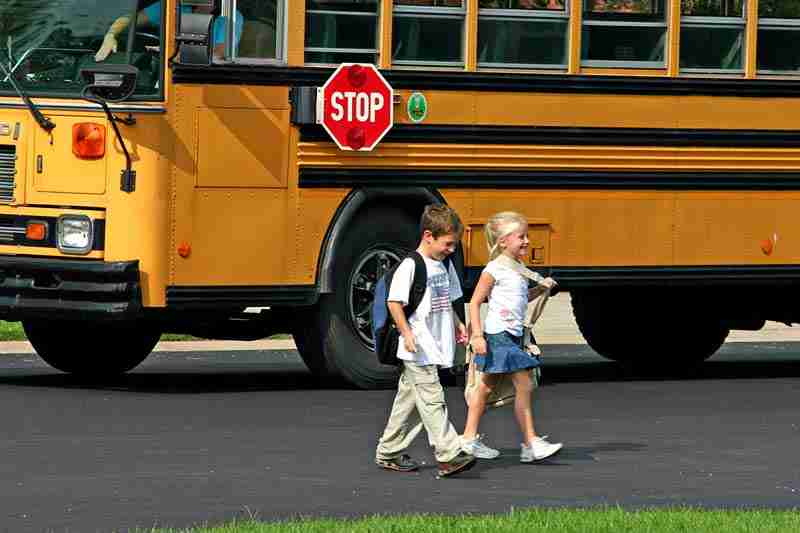 school-bus-safety-children-crossing-in-front-of-bus